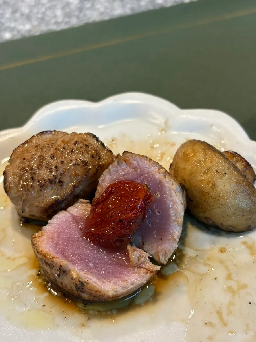Plated tenderloin topped with truffle