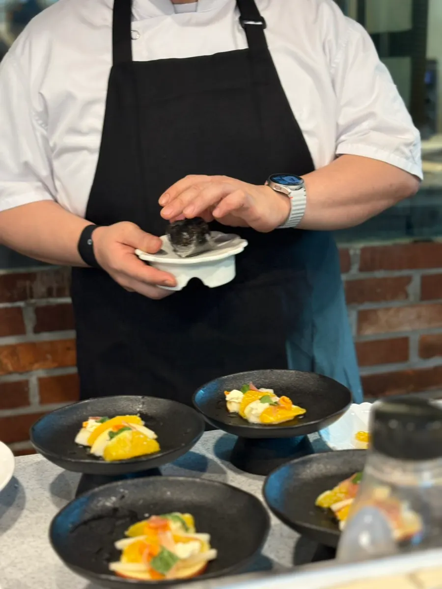 Chef showing house-made truffle oil