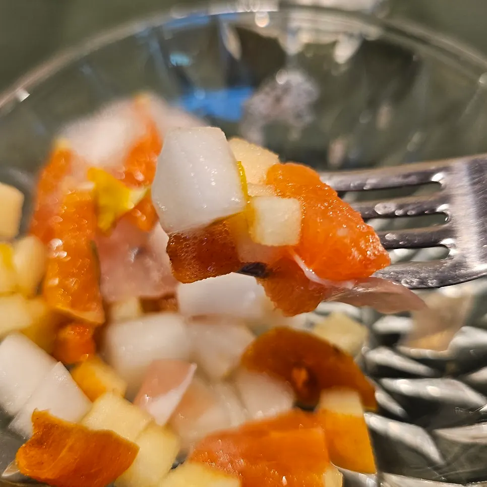 Dried persimmon, orange, apple, and prosciutto salad