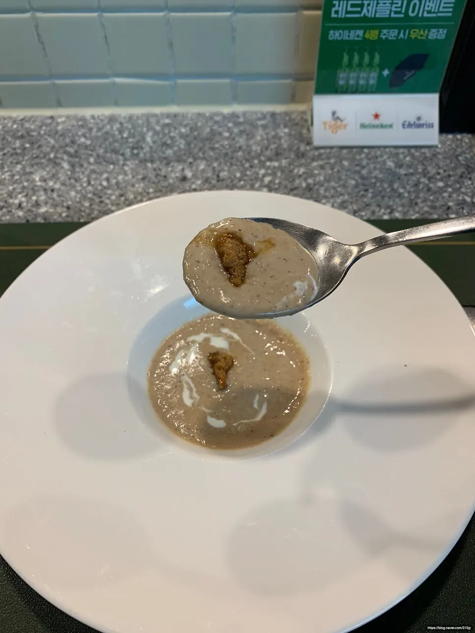Soup topped with glazed walnuts