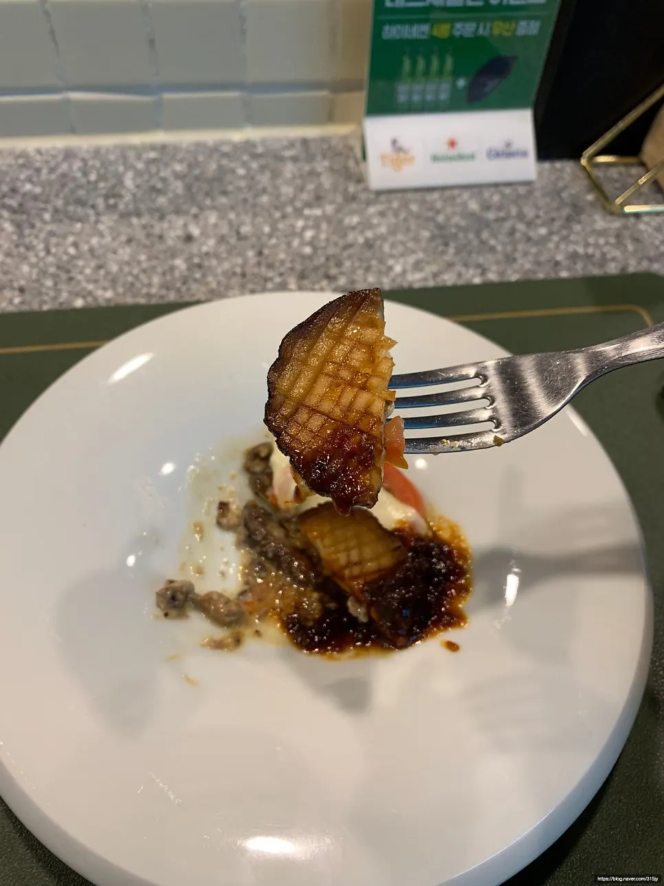 A slice of lasagna topped with grated truffle