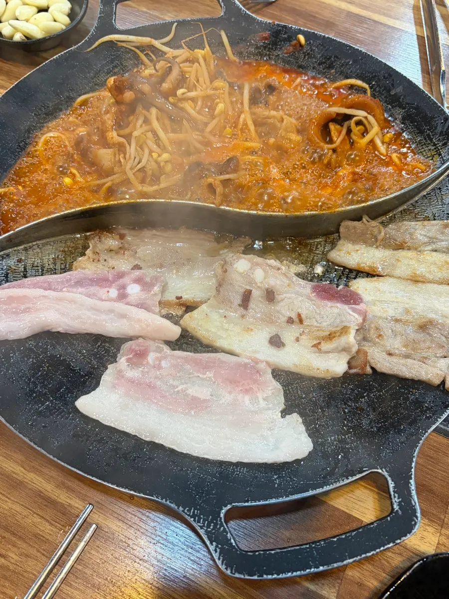 Plump jjukkumi cooking on the grill pan