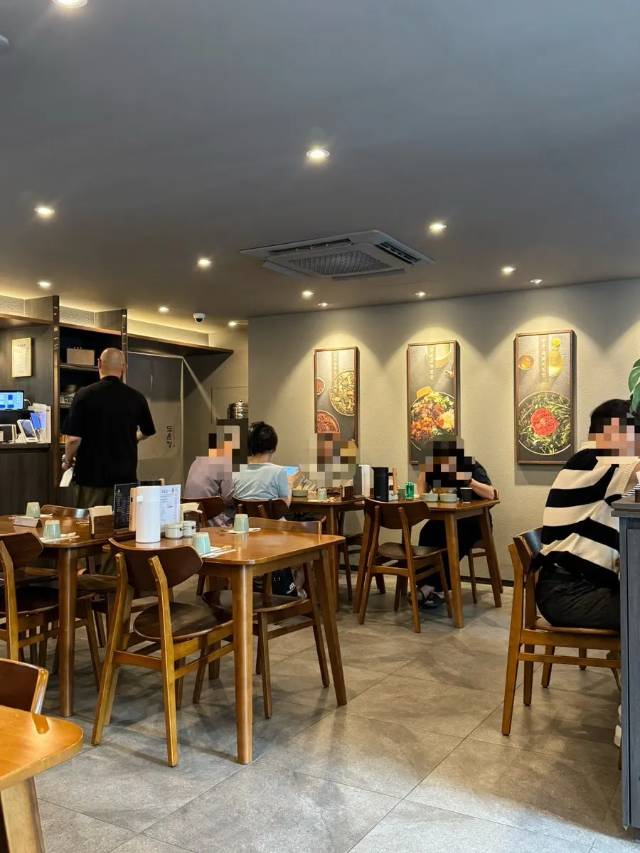 Wood-toned interior of Doonjeong Hongdae Direct Branch