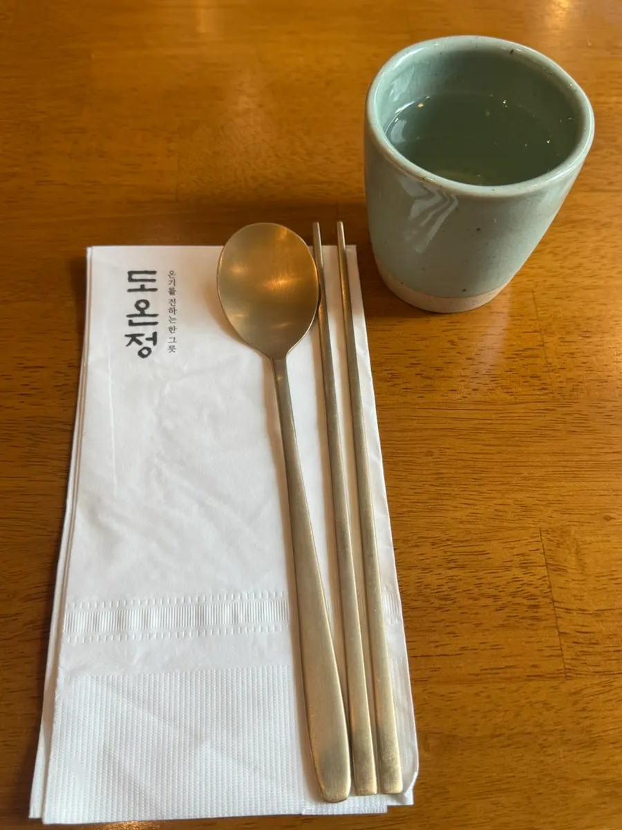Basic table setting at Doonjeong with ceramic and brassware