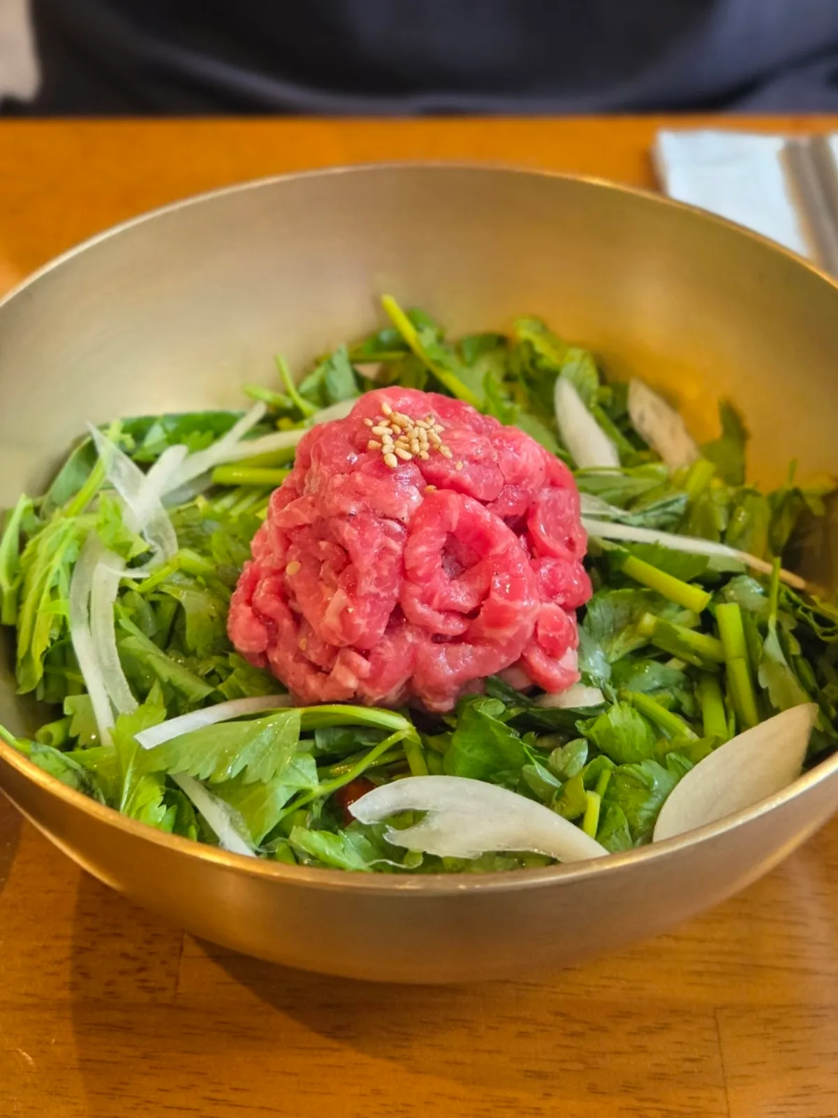 Doonjeong's yukhoe bibimbap topped with raw beef in the center