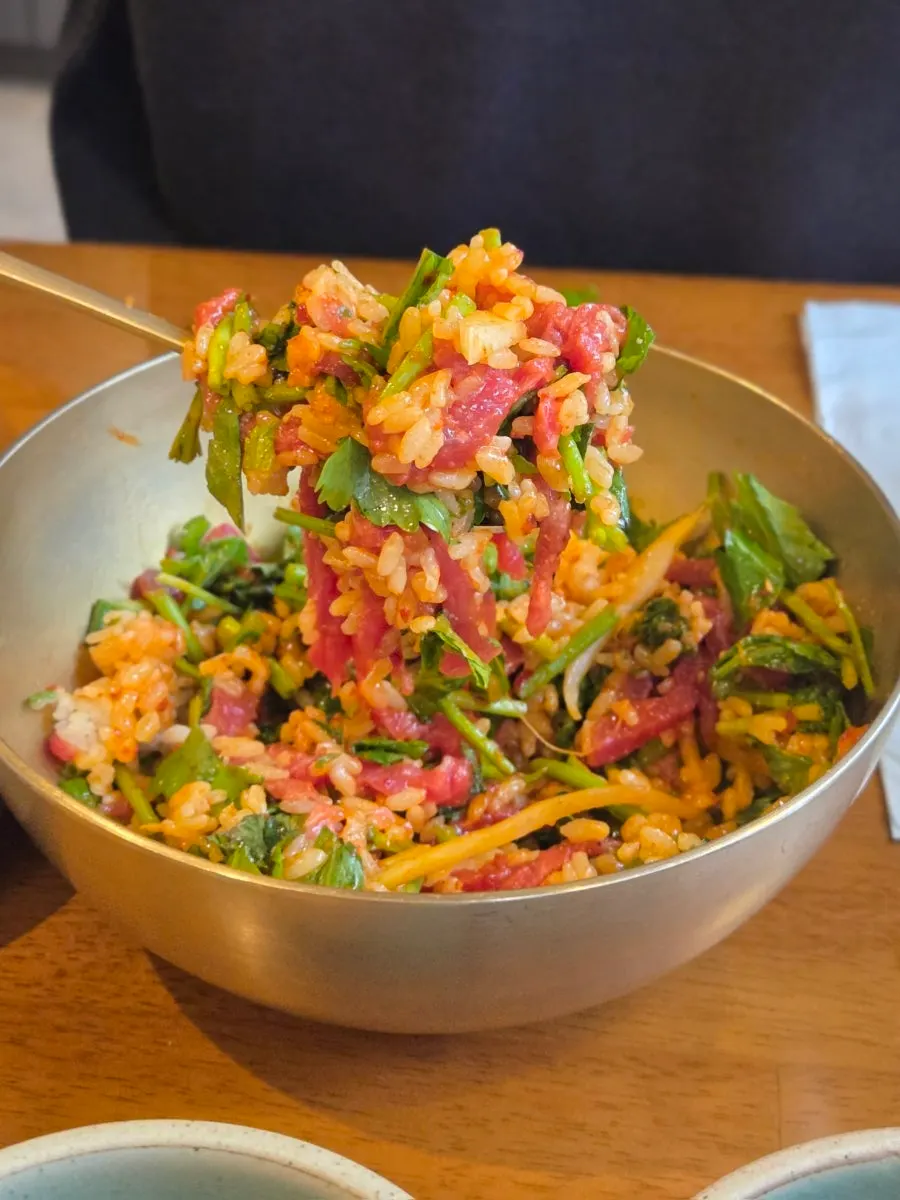 Yukhoe bibimbap mixed with plenty of minari