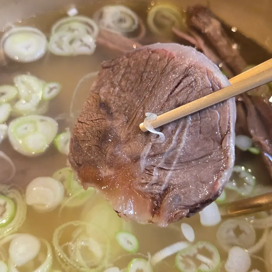 Gomtang meat with a small dish of soy sauce