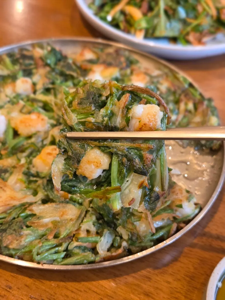 Cross-section of the minari jeon packed with shrimp