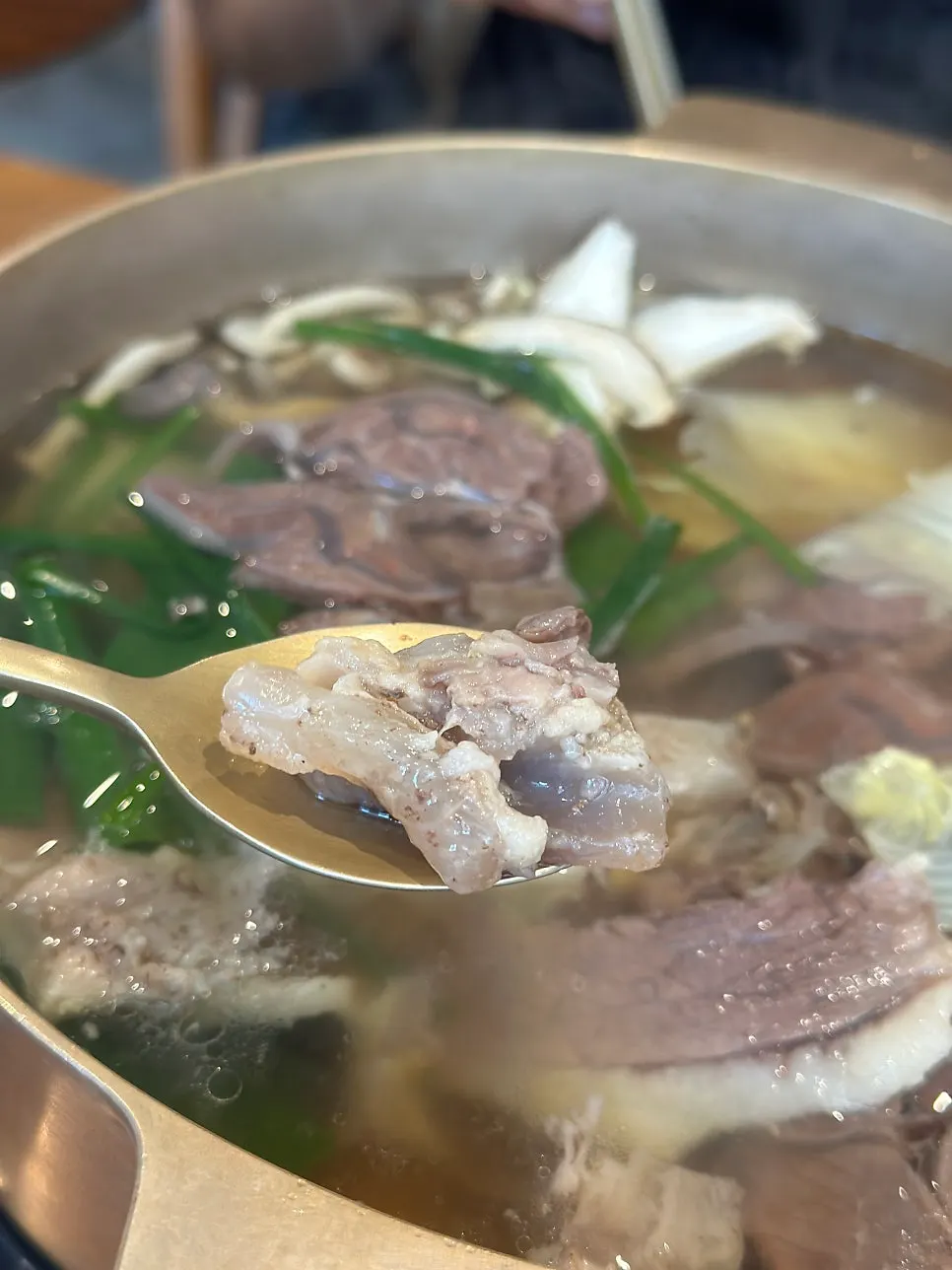 Hanwoo beef picked out of the hot pot