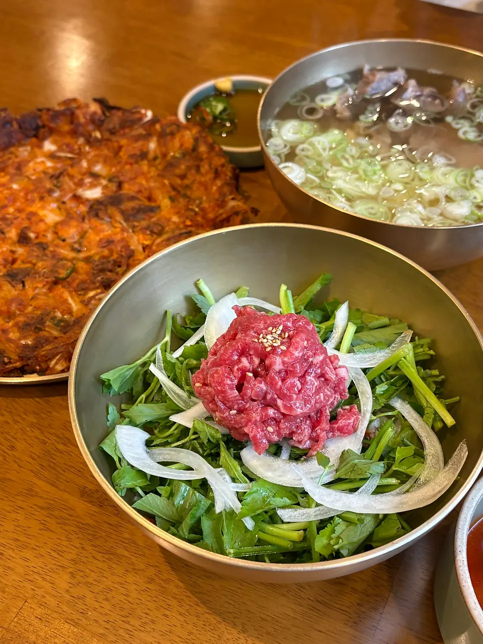 Yukhoe bibimbap topped with minari and hanwoo raw beef