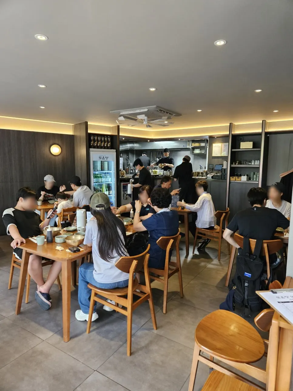 Interior of Doonjeong with soft lighting and wood tones