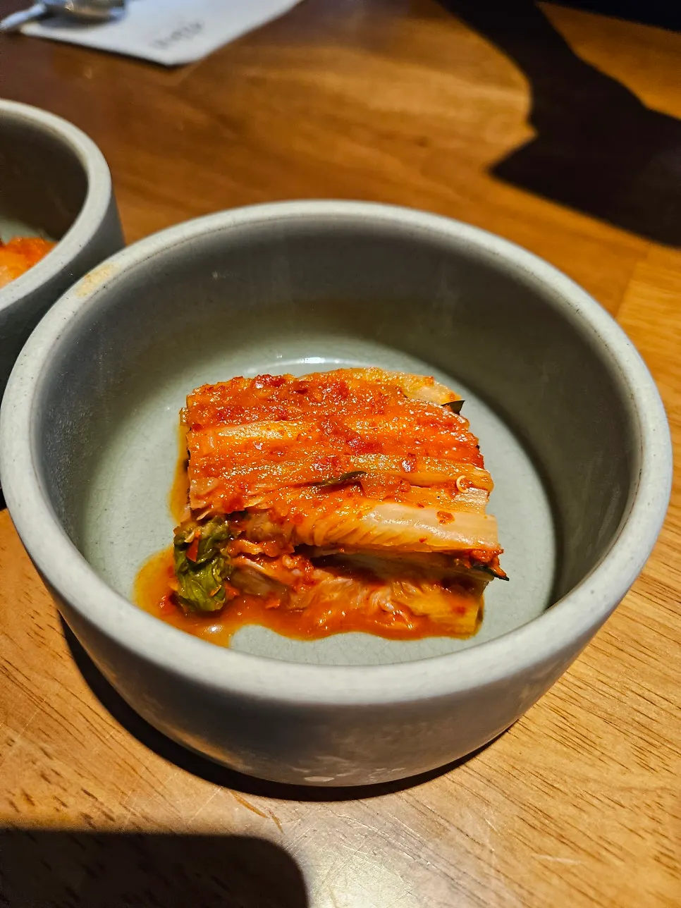 Doonjeong's basic side dishes: napa cabbage kimchi and cubed radish kimchi