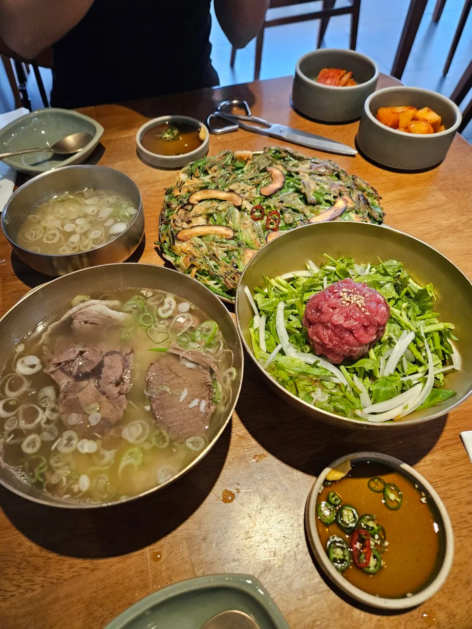 Clear broth served alongside the bibimbap