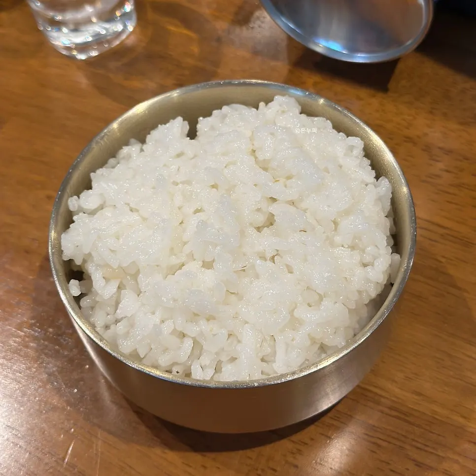 Ladle scooping up gopchang jeongol ingredients