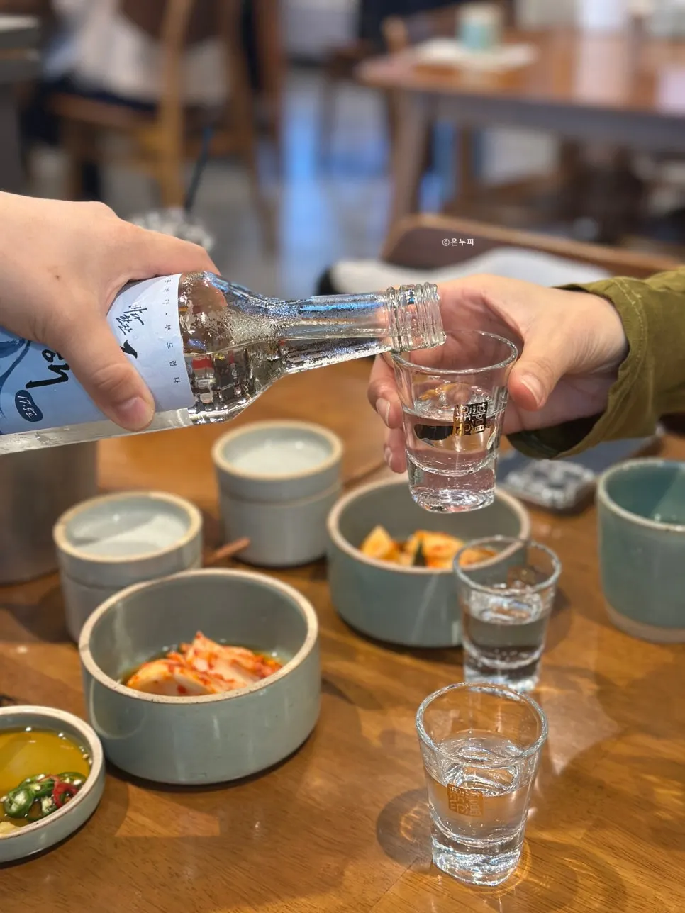 Soju Donghae chilling in a stainless steel basket full of ice