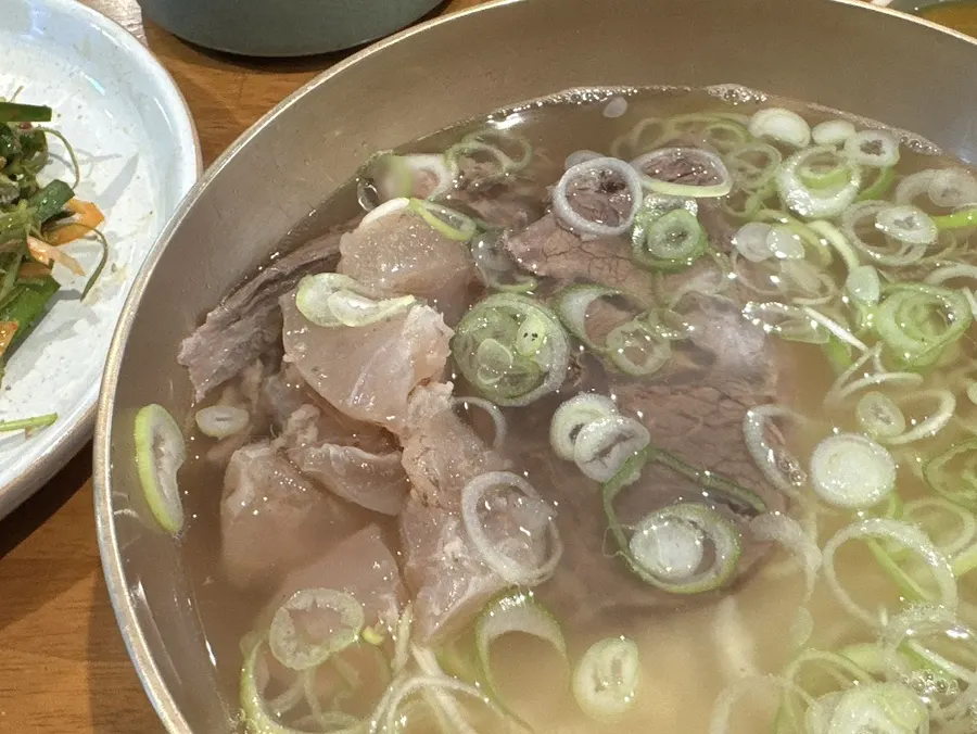 Broth and meat pieces in the clear hanwoo gomtang