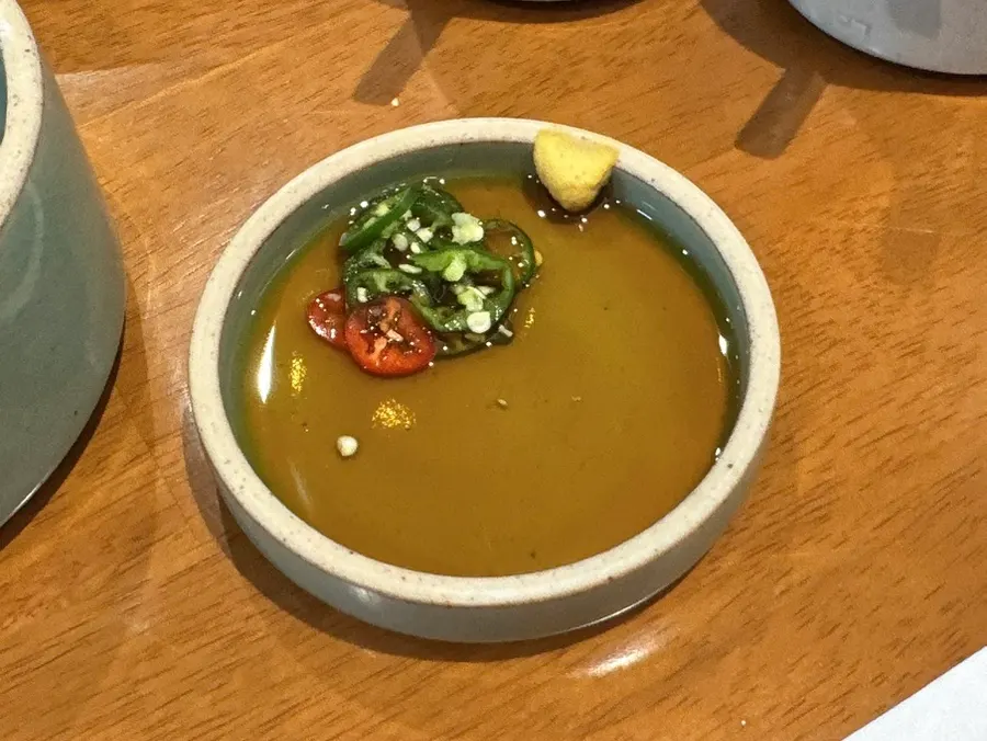 Soy dipping sauce for meat topped with wasabi