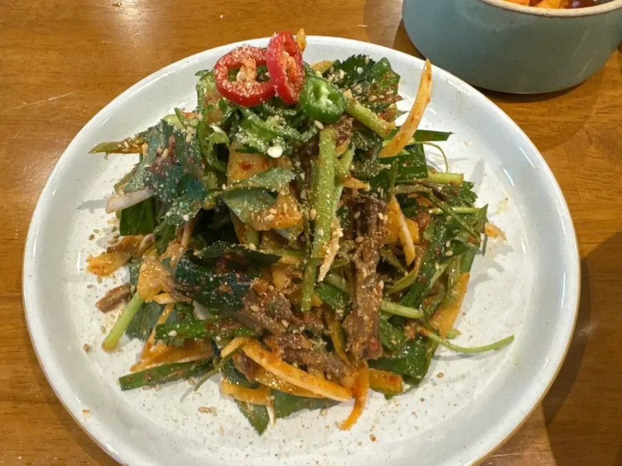 Close-up of meat muchim tossed with vegetables
