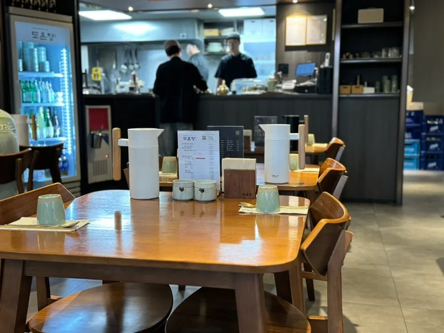 Dim, tidy dining hall seating at Doonjeong