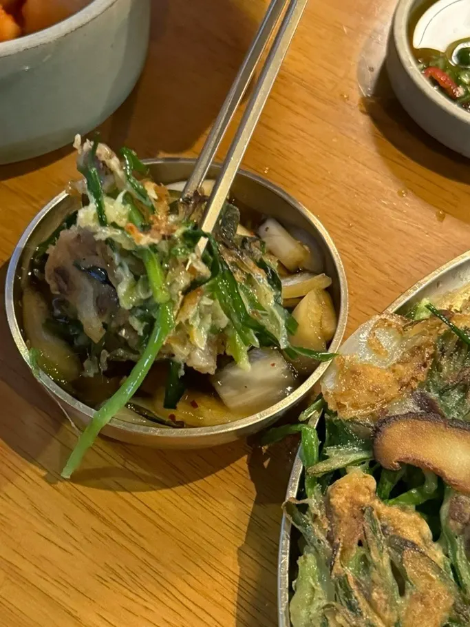 Cross-section of the meat and chive pancake with the gomtang table setting