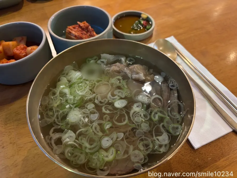 A spoonful of clear Korean beef gomtang broth