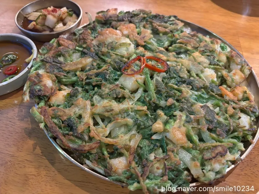 Golden-fried shrimp minari pancake served at the table