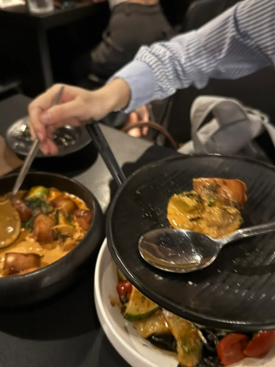 Gochujang cream gnocchi portioned onto a small plate