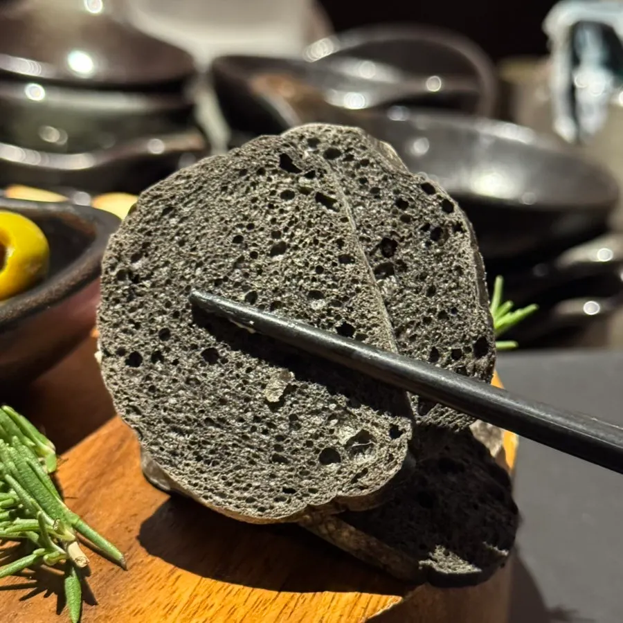Grilled bread and marinated olives on the platter