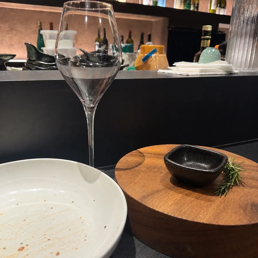Empty plate and a glass of wine