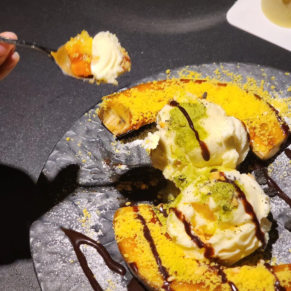 Banana brulee dessert with vanilla ice cream