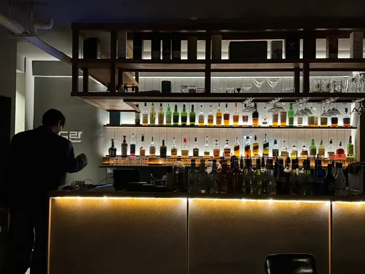 Whiskey bottles on display, including Glenmorangie Signet