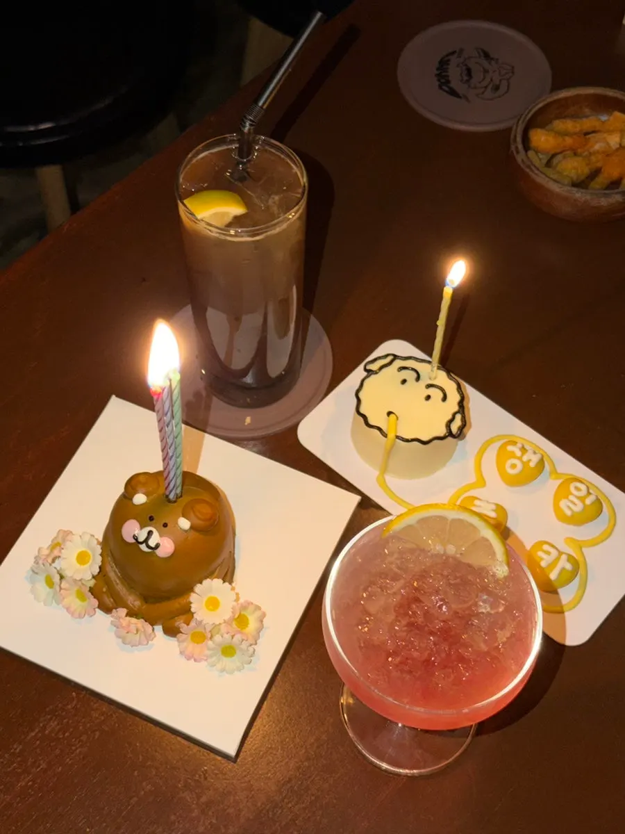 Birthday cake and candles brought in from outside