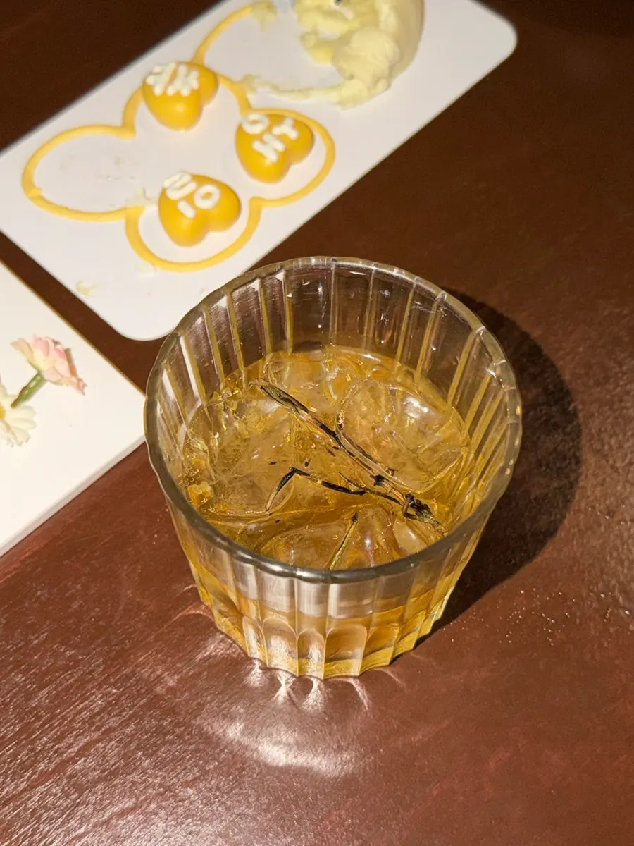 A sip taken from a neighbor's Wildflower cocktail