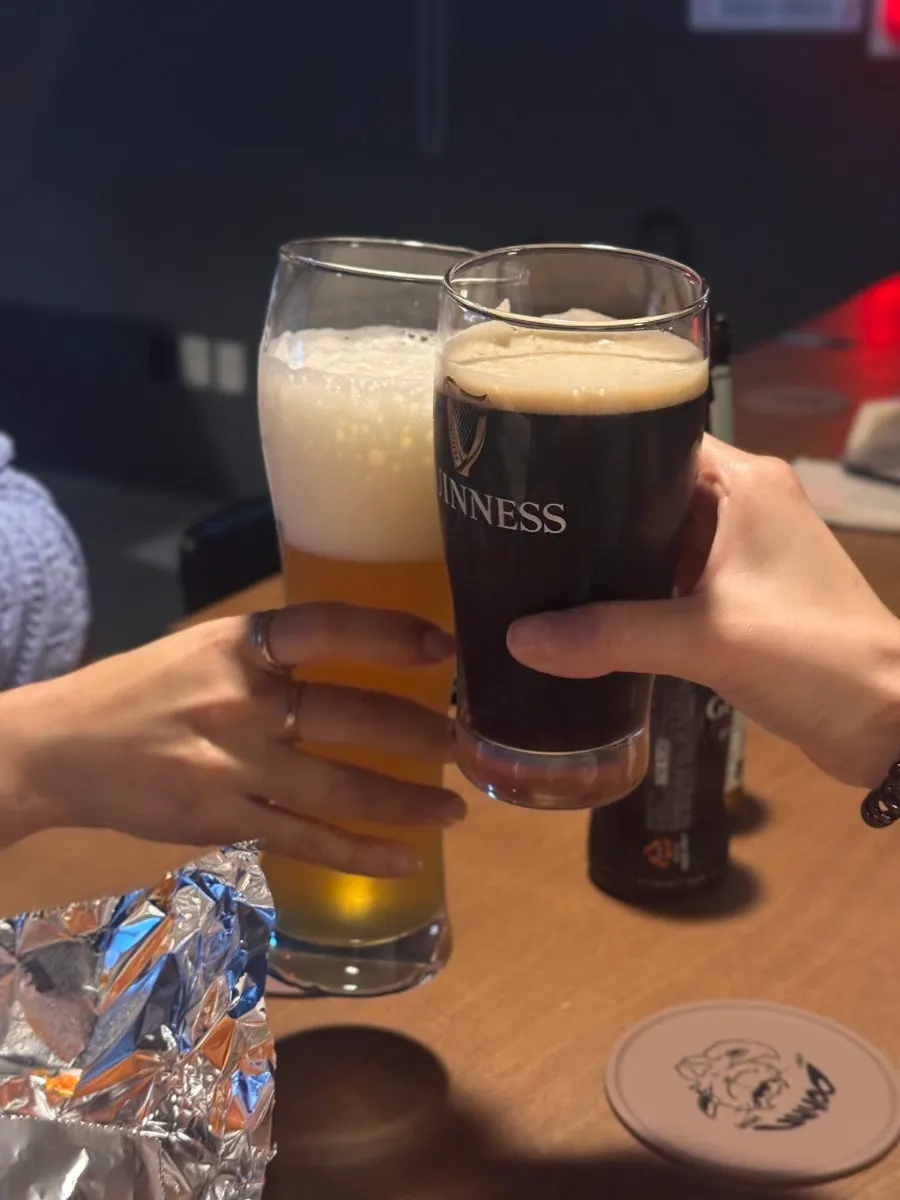 Guinness and Weihenstephan beer served in their proper glasses