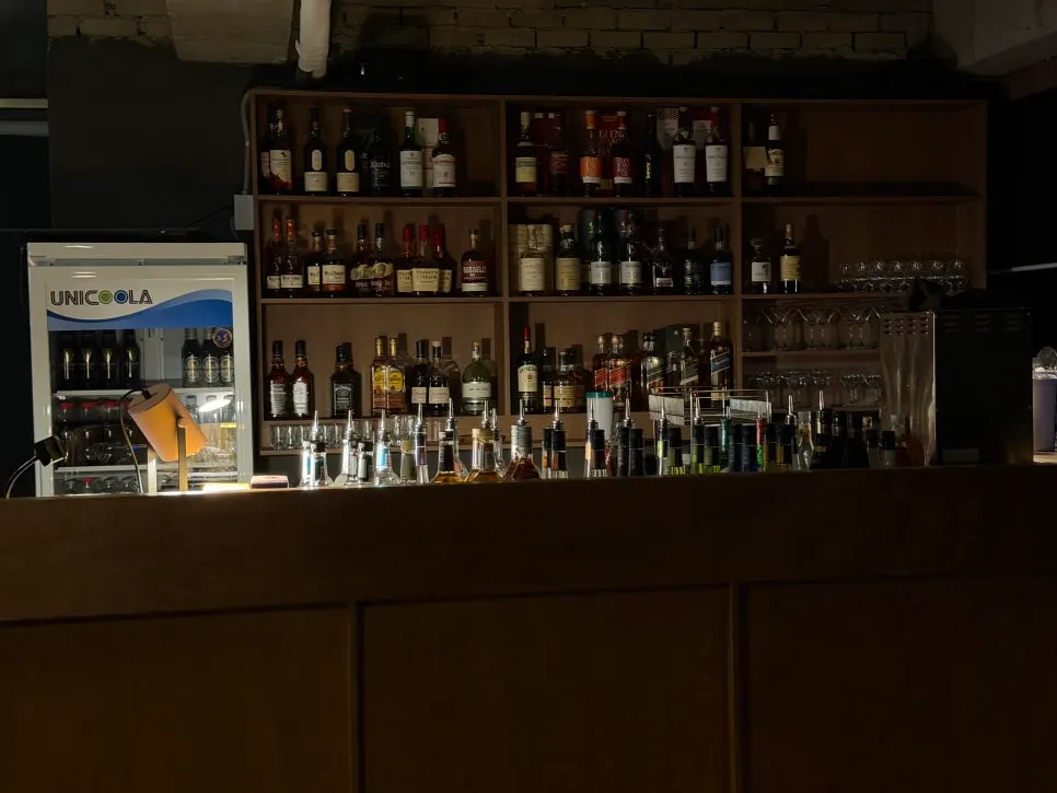 Solo bar seating area with calm lighting