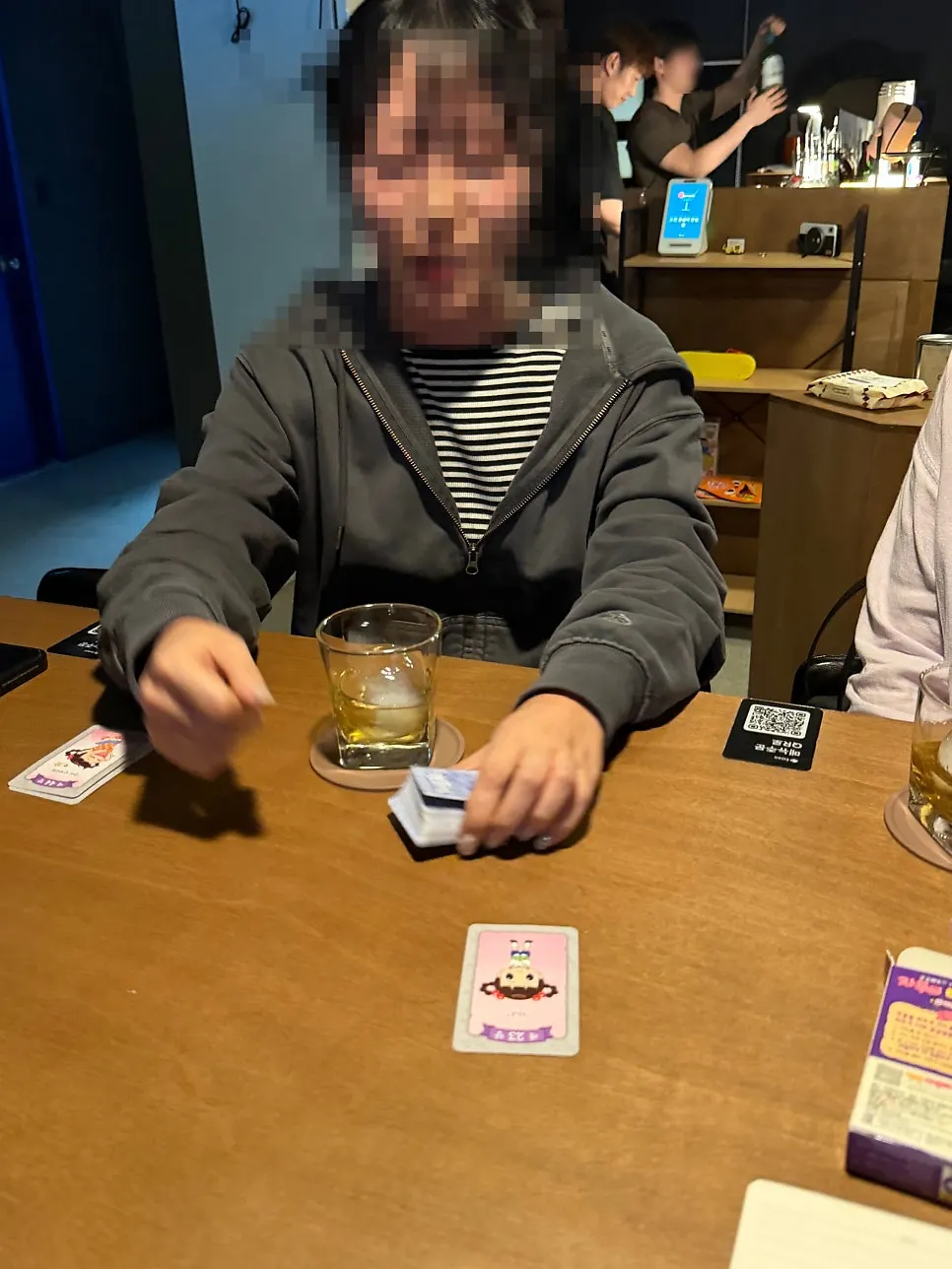 Card game laid out on the solo bar table