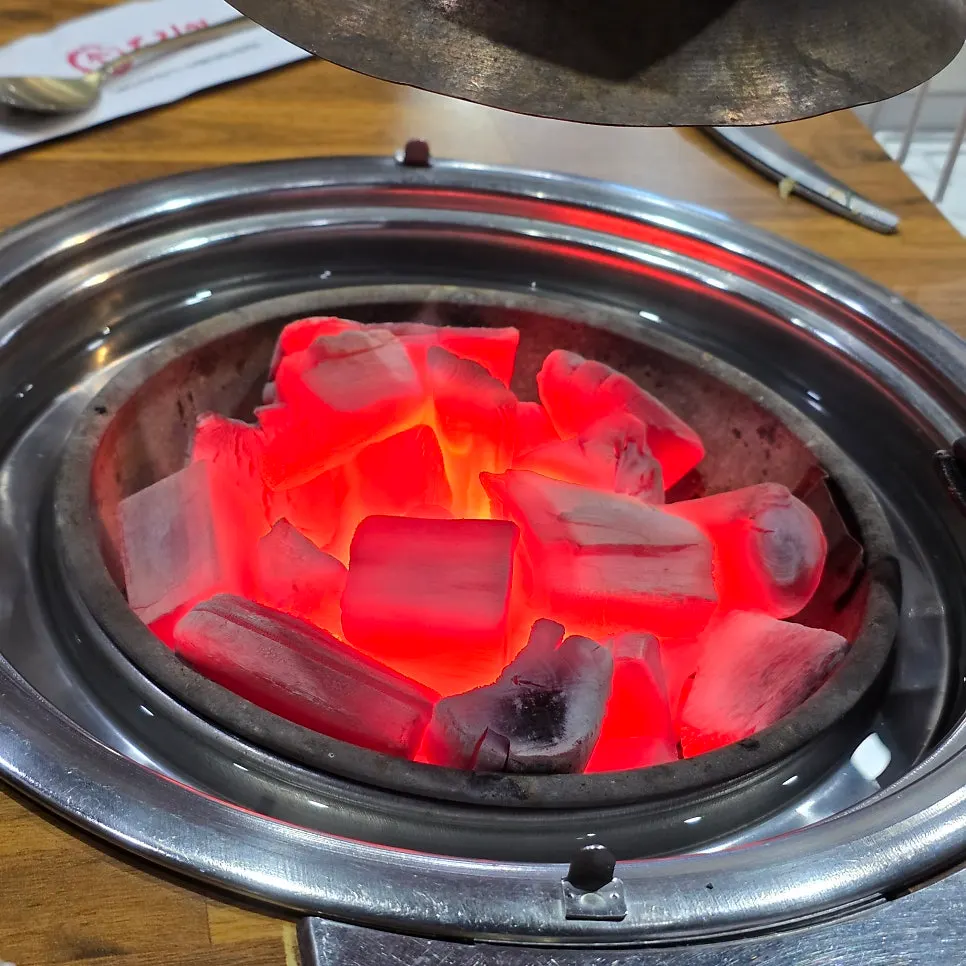 Glowing red charcoal fire