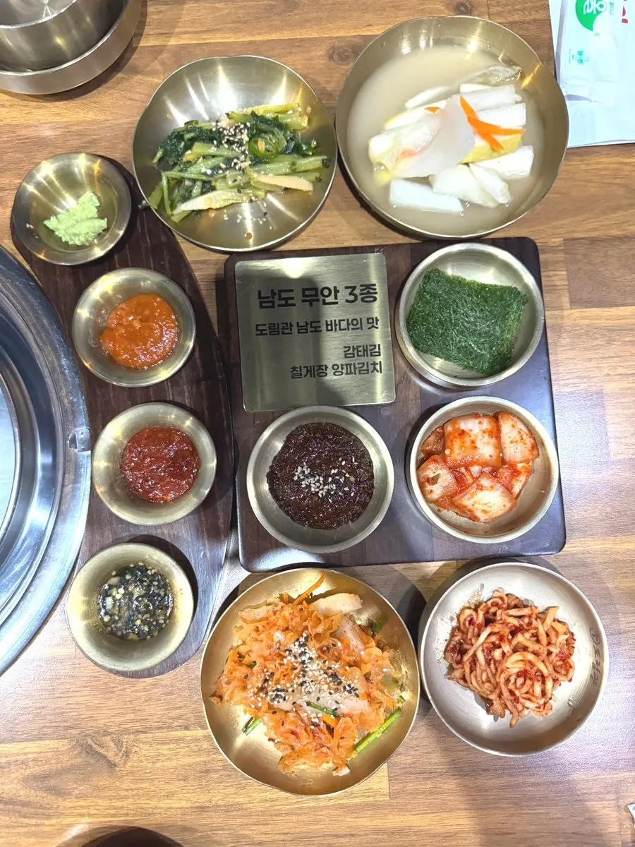 Banchan spread including side dishes seen for the first time