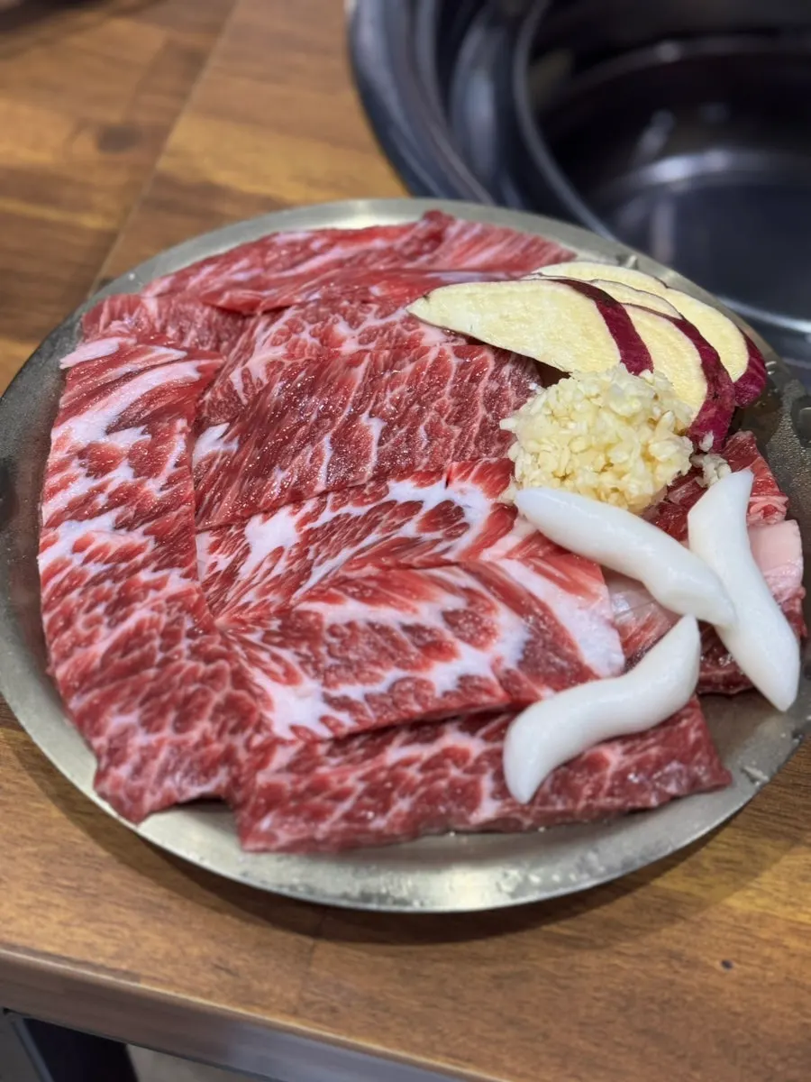 Raw hwangto garlic beef flank flower ribs on a plate