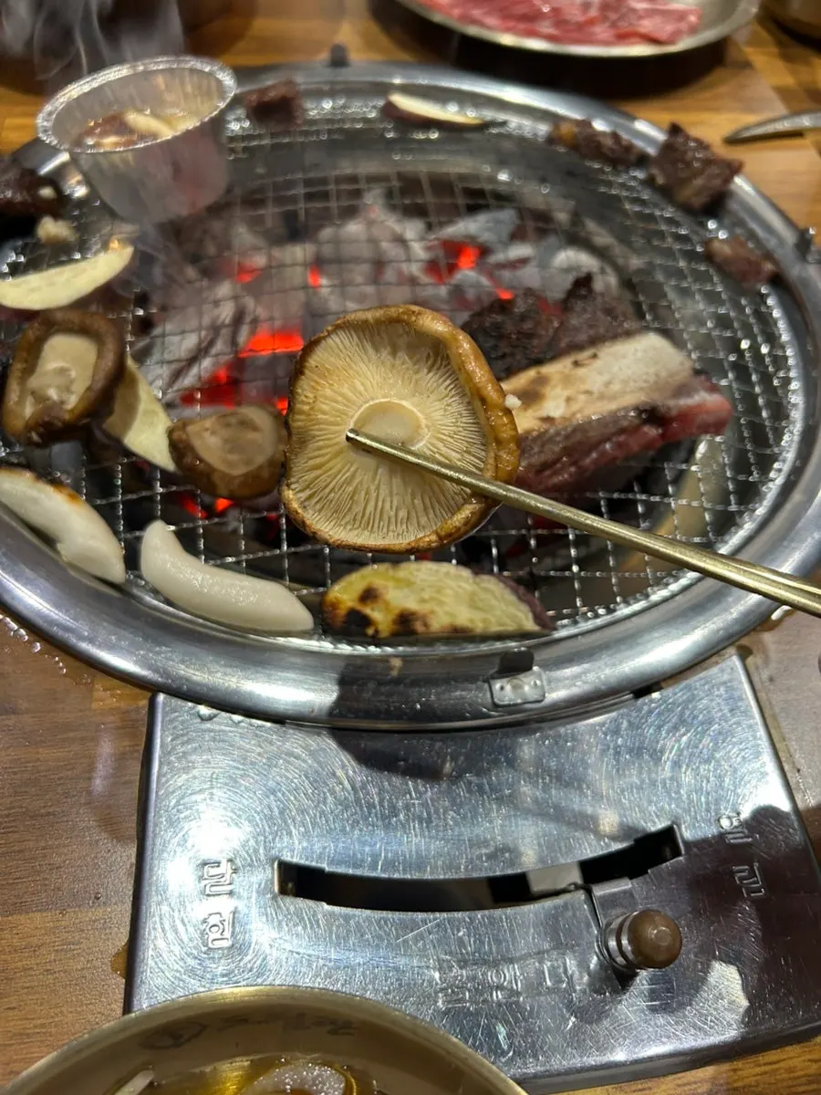 Shiitake mushrooms grilled alongside the meat