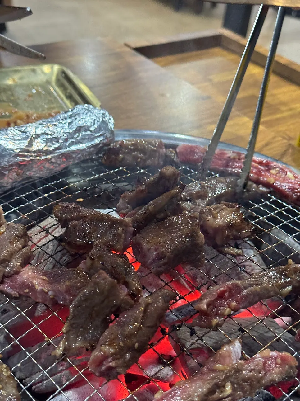 Marinated short rib for two on the grill with sweet potato and rice cake