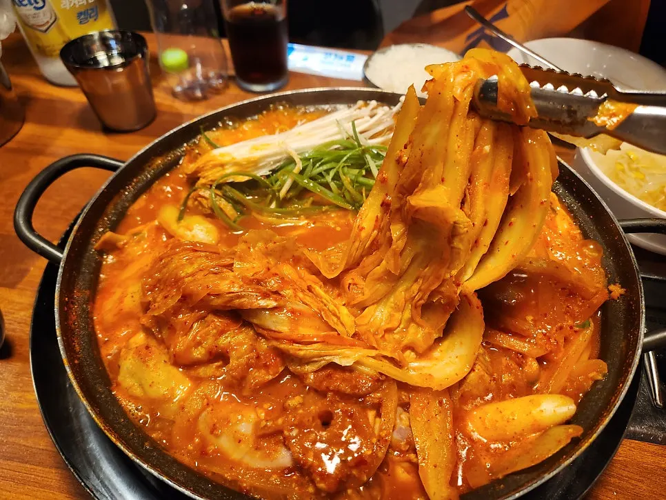Medium-size dakdoritang topped with whole pieces of aged kimchi