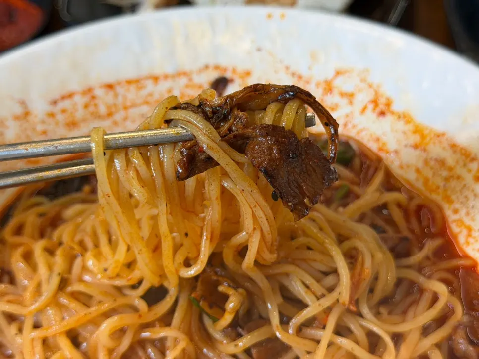 Thin homemade noodles lifted from the jjamppong