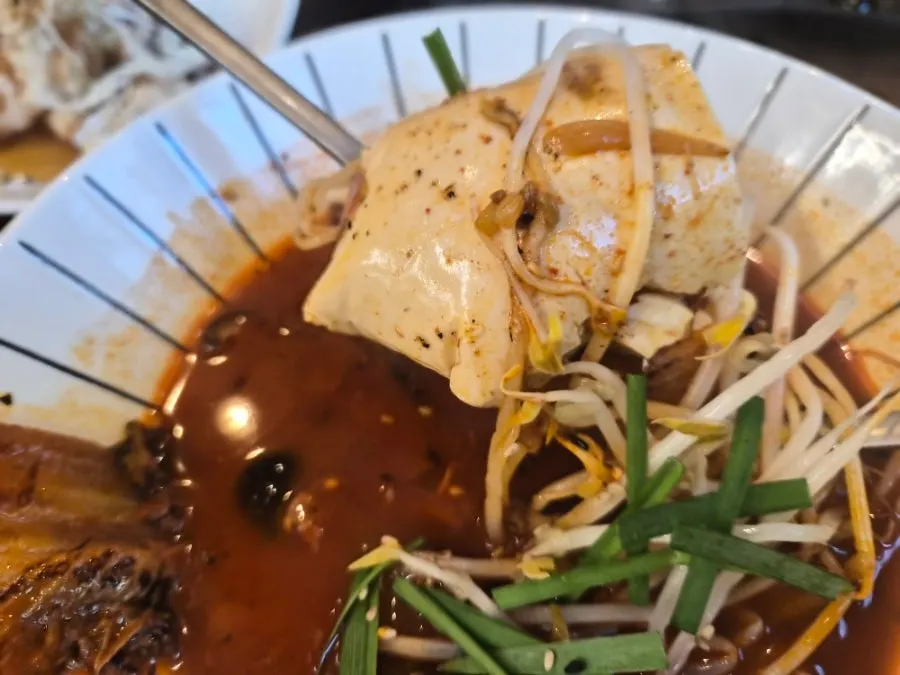 Rice mixed into sundubu jjamppong broth