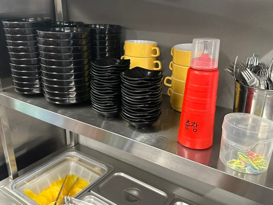Extra dishware, chunjang, hair ties, and aprons
