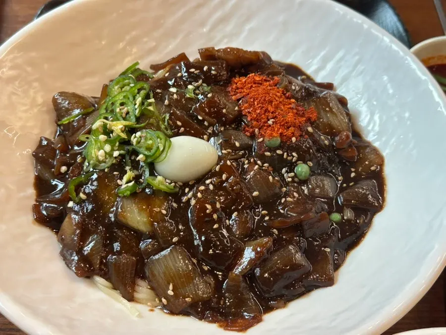 Sweet and sour pork dipped in sauce