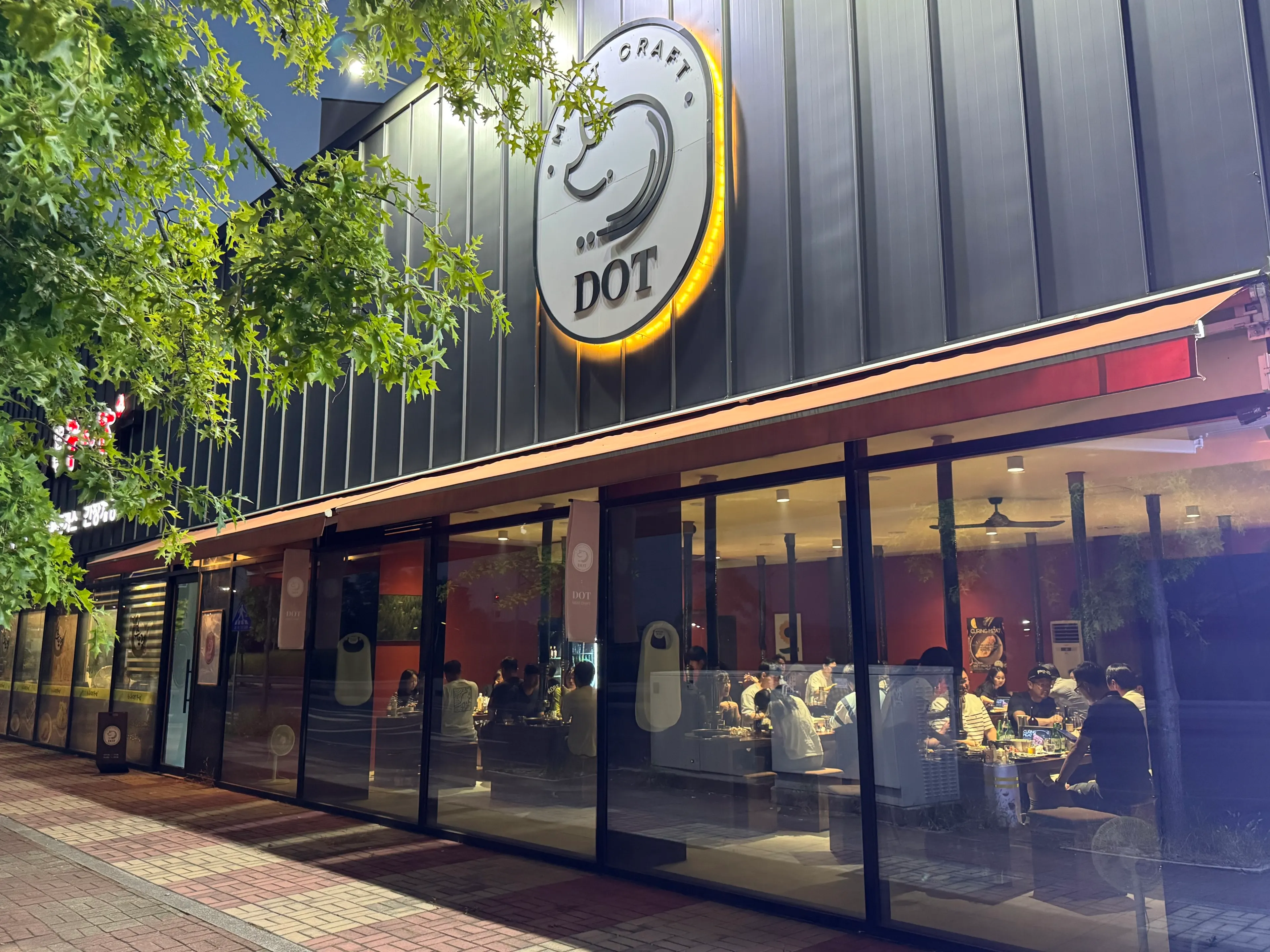 Store view of Dot Osong with the open kitchen visible