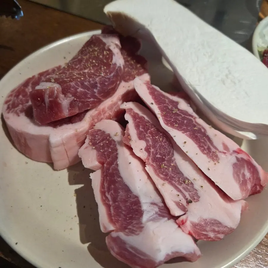 A perfectly grilled piece of pork jowl and pork neck