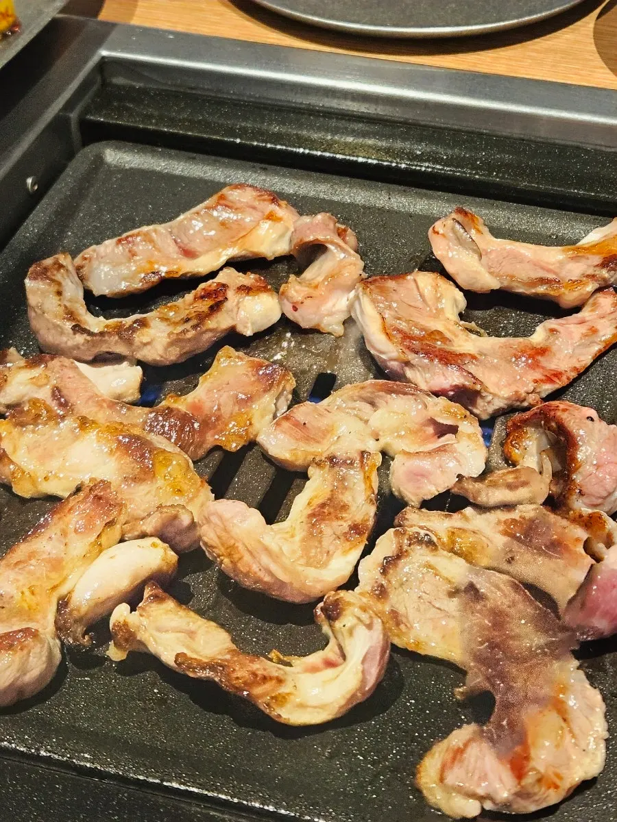 Hangjeongsal browning nicely on the grill