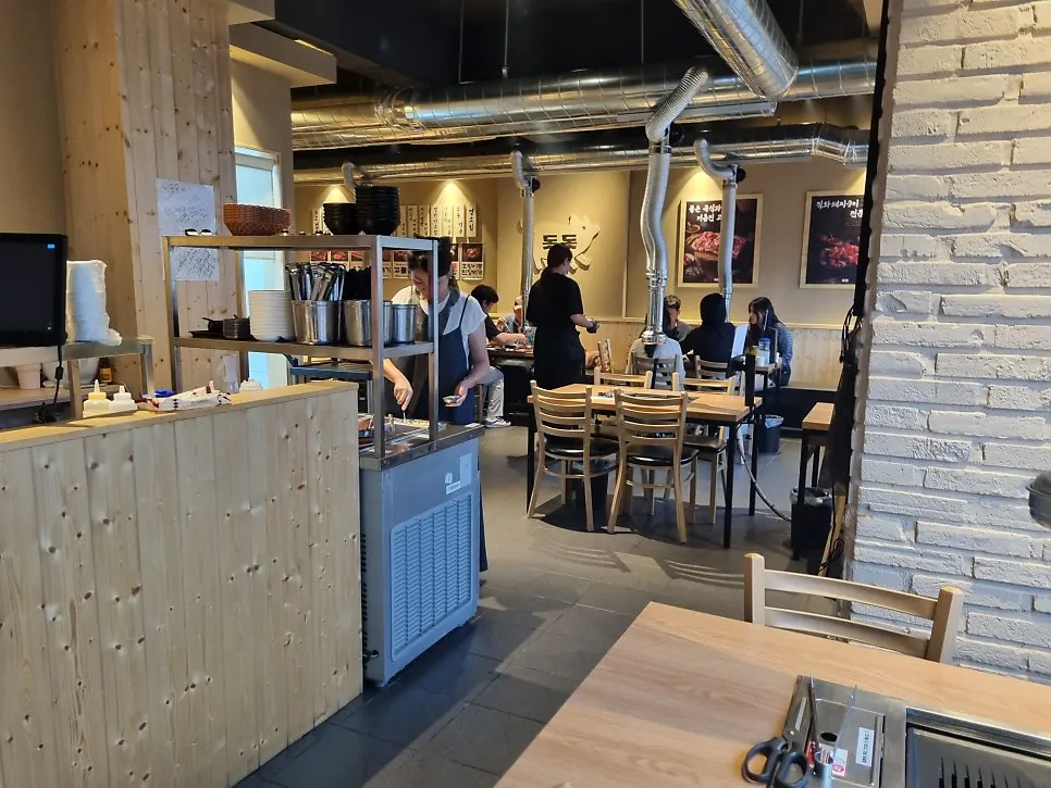 Self-serve corner and entrance table at Dotdot Milyang Main Branch